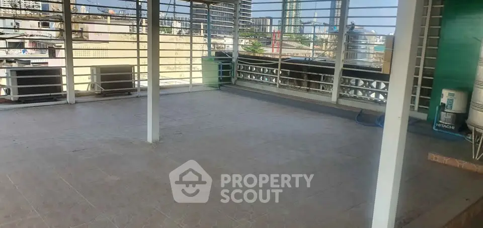 Spacious rooftop terrace with city views, perfect for relaxation and entertainment.