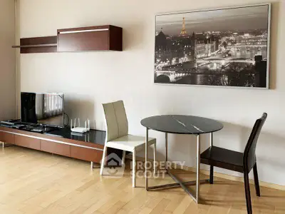 Stylish living room with modern furniture and elegant wall art, perfect for urban living.