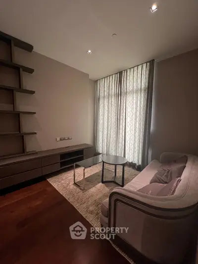 Elegant living room with modern furniture and floor-to-ceiling windows