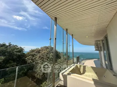 Luxurious balcony with ocean view and private jacuzzi in modern apartment