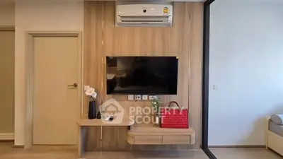 Modern living room with wall-mounted TV and air conditioning unit, featuring sleek wooden paneling and stylish decor.