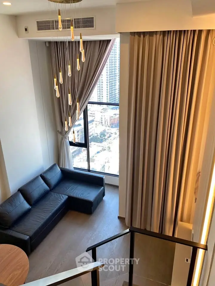 Luxurious high-ceiling living room with modern decor and stunning city view