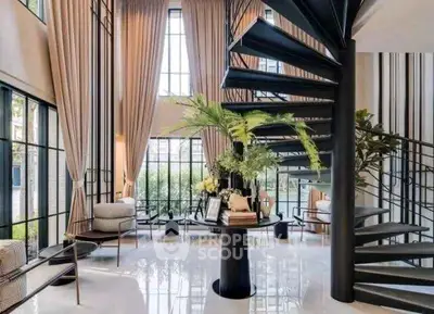 Luxurious modern living room with spiral staircase and floor-to-ceiling windows