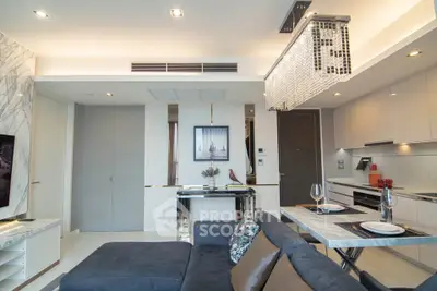Luxurious modern living room with open kitchen, elegant decor, and stylish lighting in a high-end apartment.