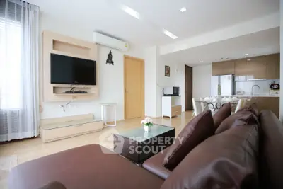 Spacious modern living room with open kitchen and stylish decor