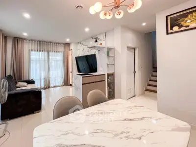 Modern living room with marble dining table and stylish lighting