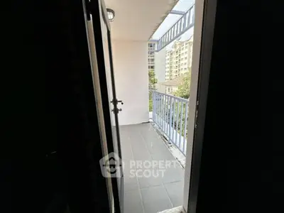 Charming balcony with city view, perfect for relaxation and enjoying the outdoors.