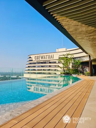 Luxurious rooftop pool with stunning city views at Chewathai residence.