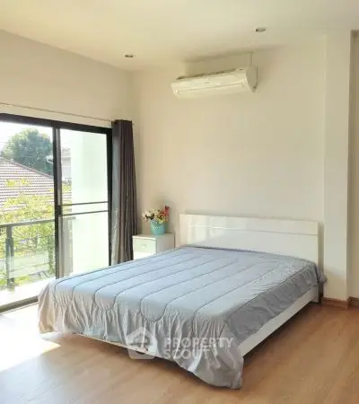 Bright and airy bedroom with large window and modern decor