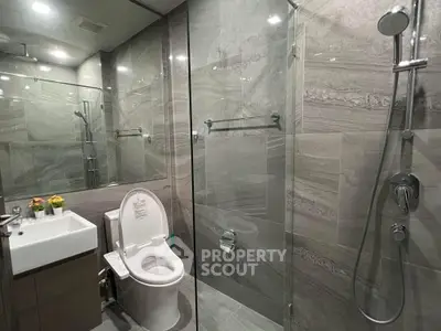 Modern bathroom with glass shower and sleek fixtures