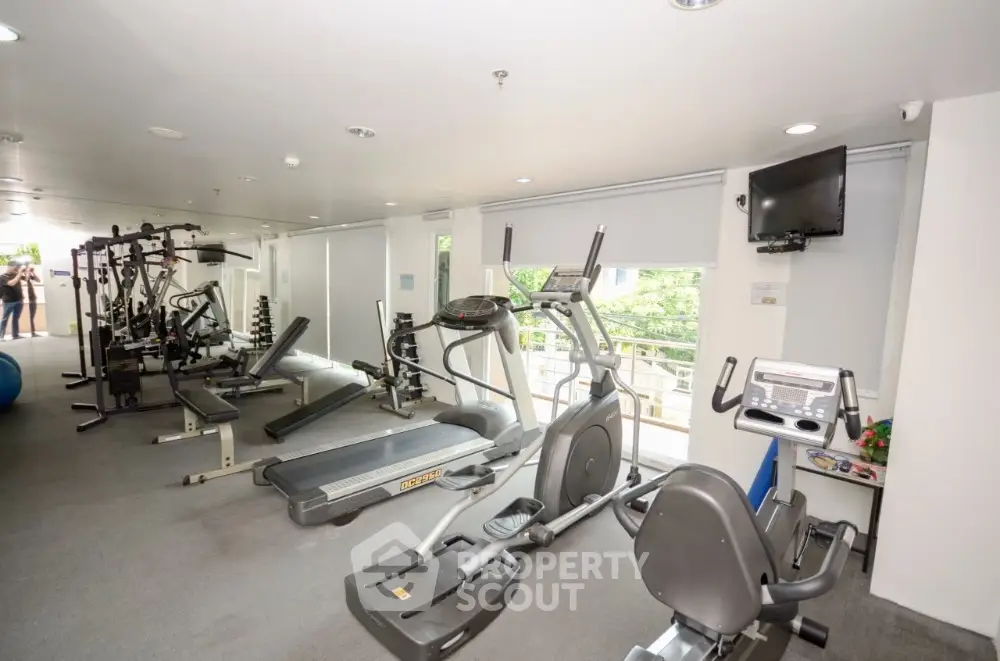 Modern gym with state-of-the-art fitness equipment and natural light