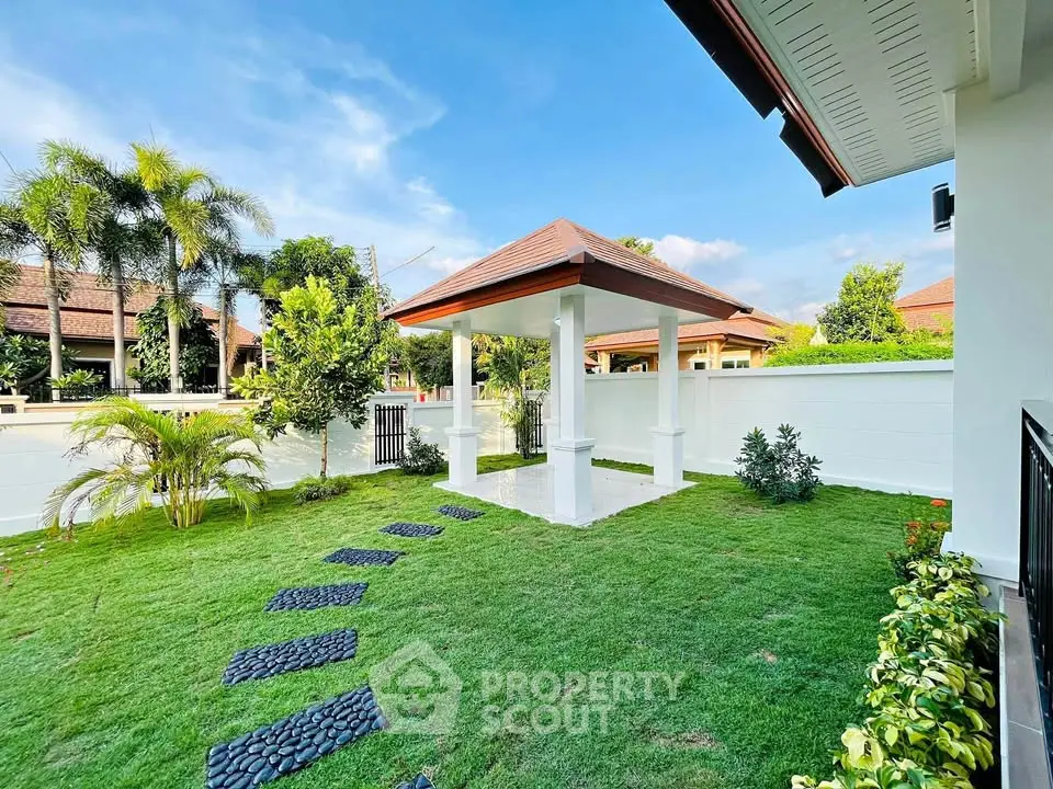 Charming garden with gazebo and lush greenery in a serene residential area