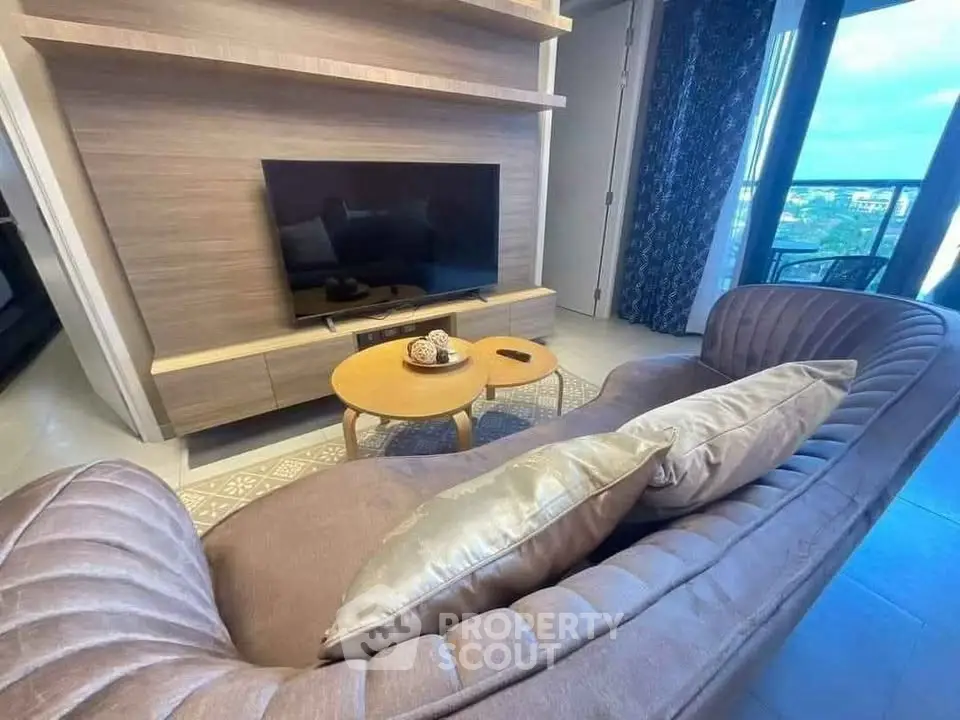 Stylish living room with modern TV setup and cozy seating area
