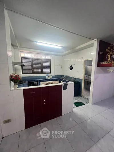 Spacious kitchen with open layout and modern appliances in a well-lit home.