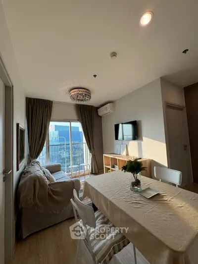 Charming living room with elegant decor and city view, featuring cozy seating and modern amenities.