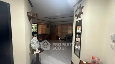 Spacious living room with natural light and cozy decor