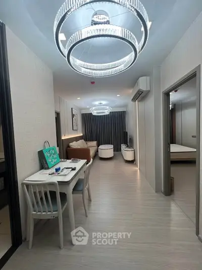Modern living room with stylish lighting and open layout, perfect for contemporary living.