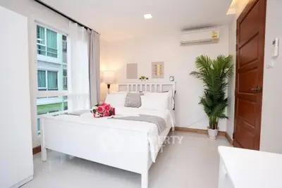 Bright and cozy bedroom with modern decor and natural light