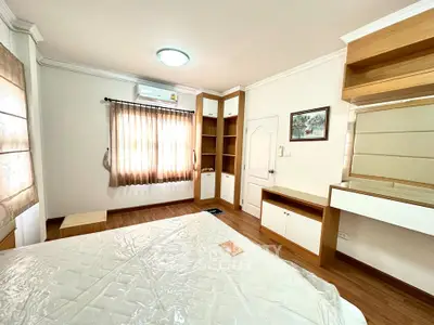 Cozy bedroom with built-in storage and natural light