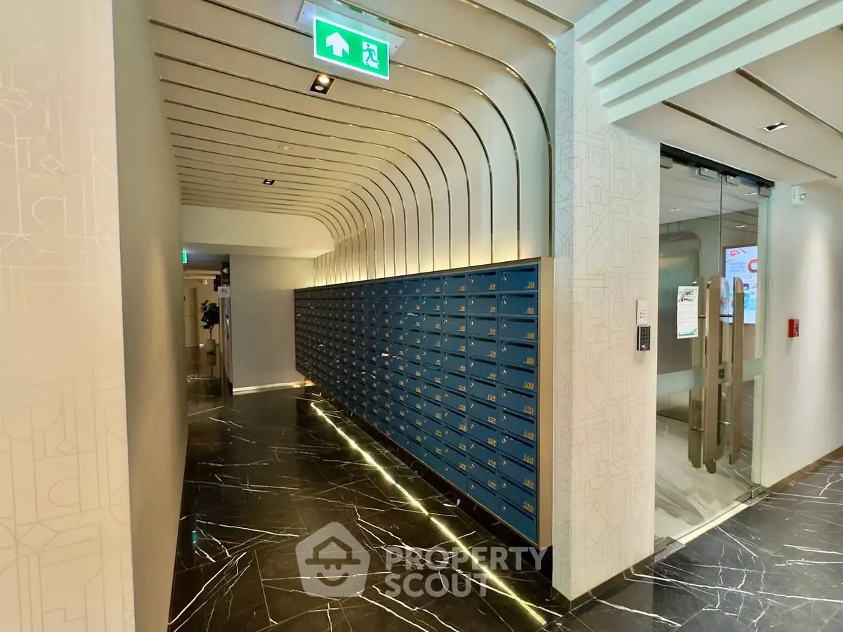 Modern building corridor with sleek mailboxes and elegant marble flooring