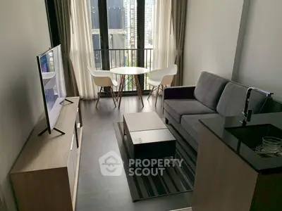 Modern living room with sleek furniture and city view balcony