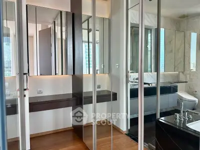 Luxurious modern bathroom with sleek design and city view, featuring elegant fixtures and marble accents.