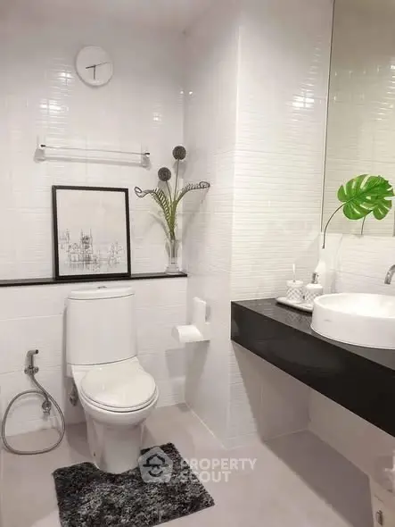 Modern bathroom with sleek white tiles and stylish decor