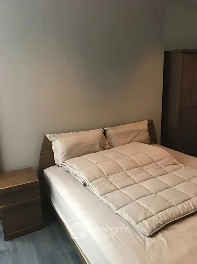 Cozy bedroom with modern wooden furniture and neutral decor