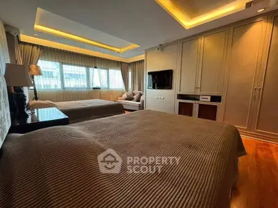 Luxurious bedroom with elegant lighting and large windows in a modern apartment.