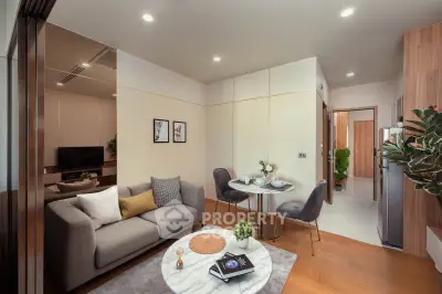 Modern living room with cozy seating and elegant dining area in a stylish apartment.