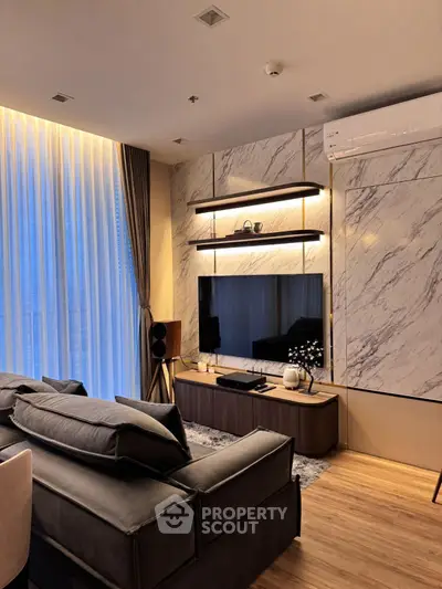 Luxurious modern living room with elegant marble wall and stylish furniture