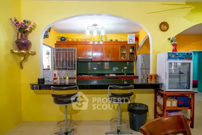 Vibrant kitchen with open layout and modern bar seating
