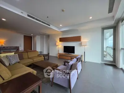 Spacious modern living room with elegant furniture and large windows