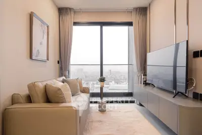 Modern living room with large window offering city view, cozy sofa, and sleek TV setup.