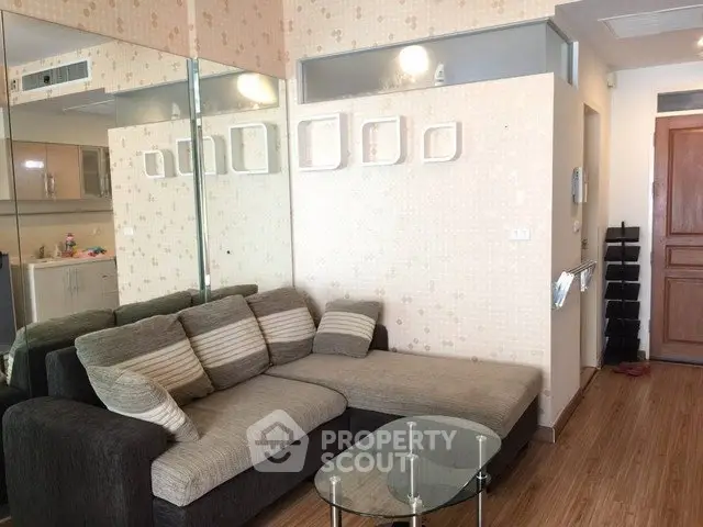 Cozy living room with modern decor and comfortable sofa in stylish apartment.