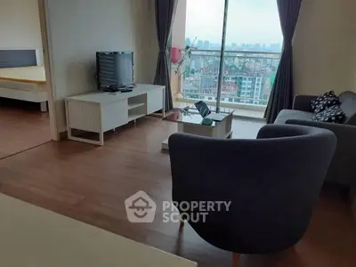 Spacious living room with city view and modern furnishings