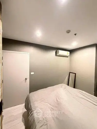 Cozy bedroom with modern air conditioning and soft lighting