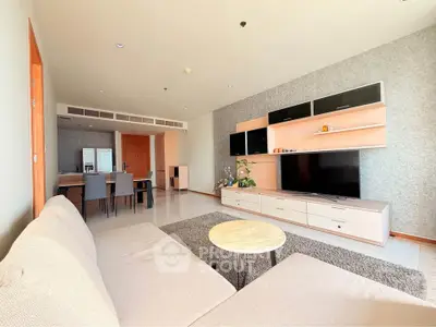 Spacious modern living room with stylish furniture and entertainment center
