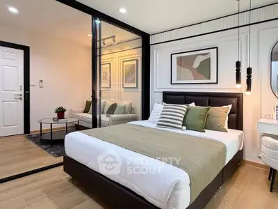 Modern bedroom with glass partition and stylish decor
