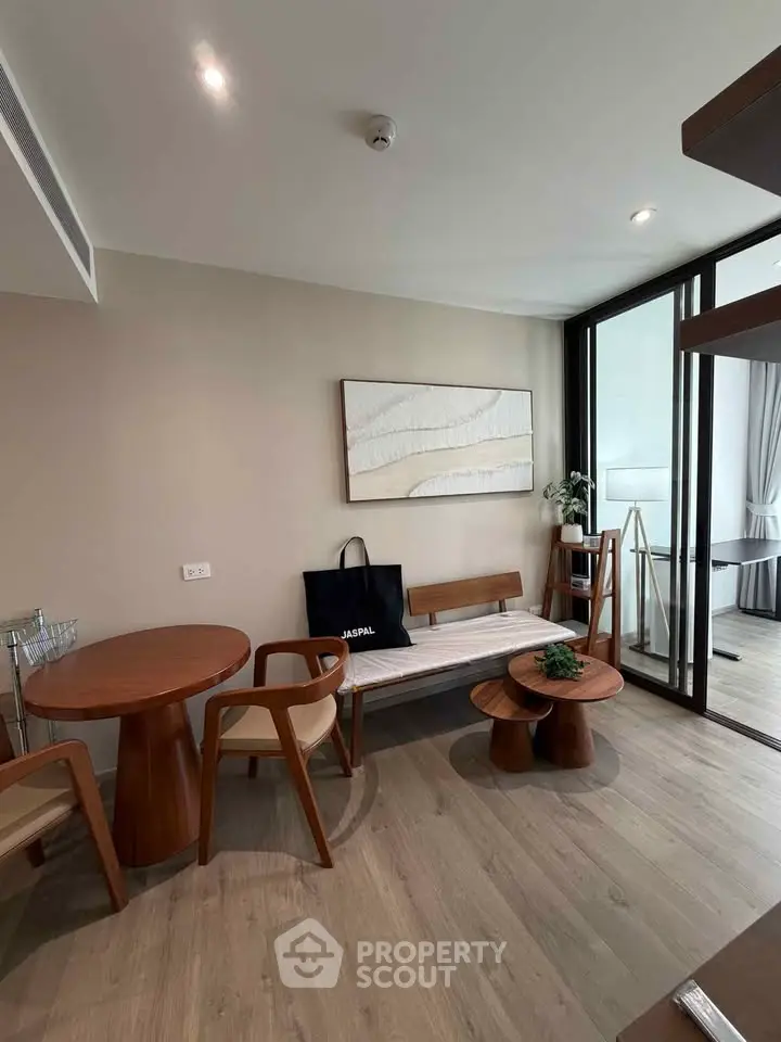 Modern living room with stylish wooden furniture and elegant decor, featuring a cozy seating area and natural light.