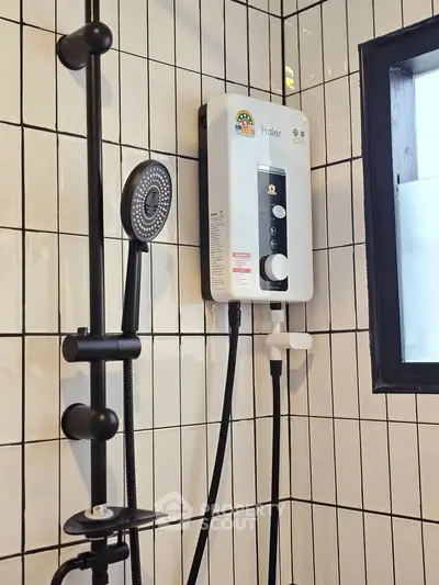 Modern bathroom with sleek shower and water heater on tiled wall