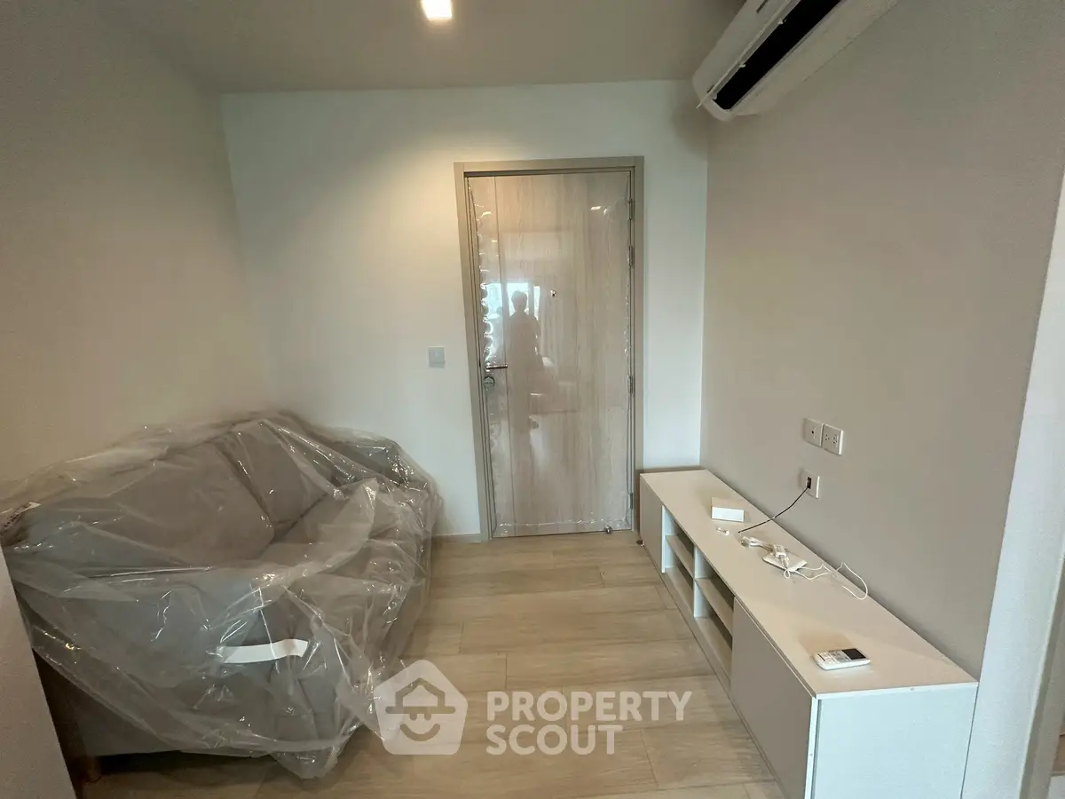 Modern living room with minimalist furniture and air conditioning