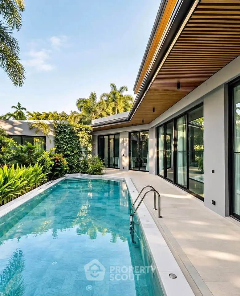 Luxurious modern villa with private pool and lush garden, perfect for serene living.