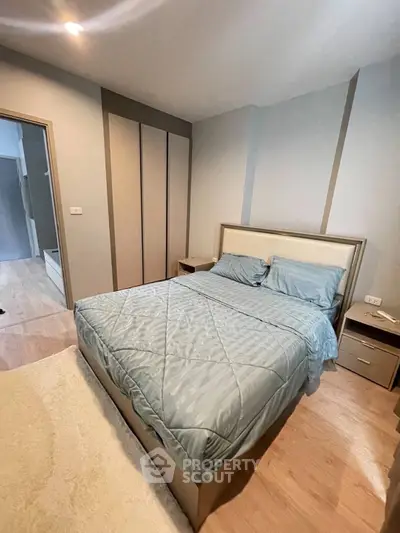Cozy bedroom with modern design and soft lighting, featuring a comfortable bed and stylish decor.