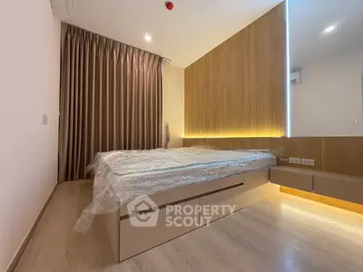 Modern bedroom with sleek design and ambient lighting