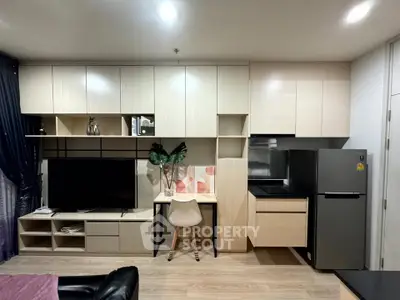 Modern living room with sleek cabinetry and integrated appliances