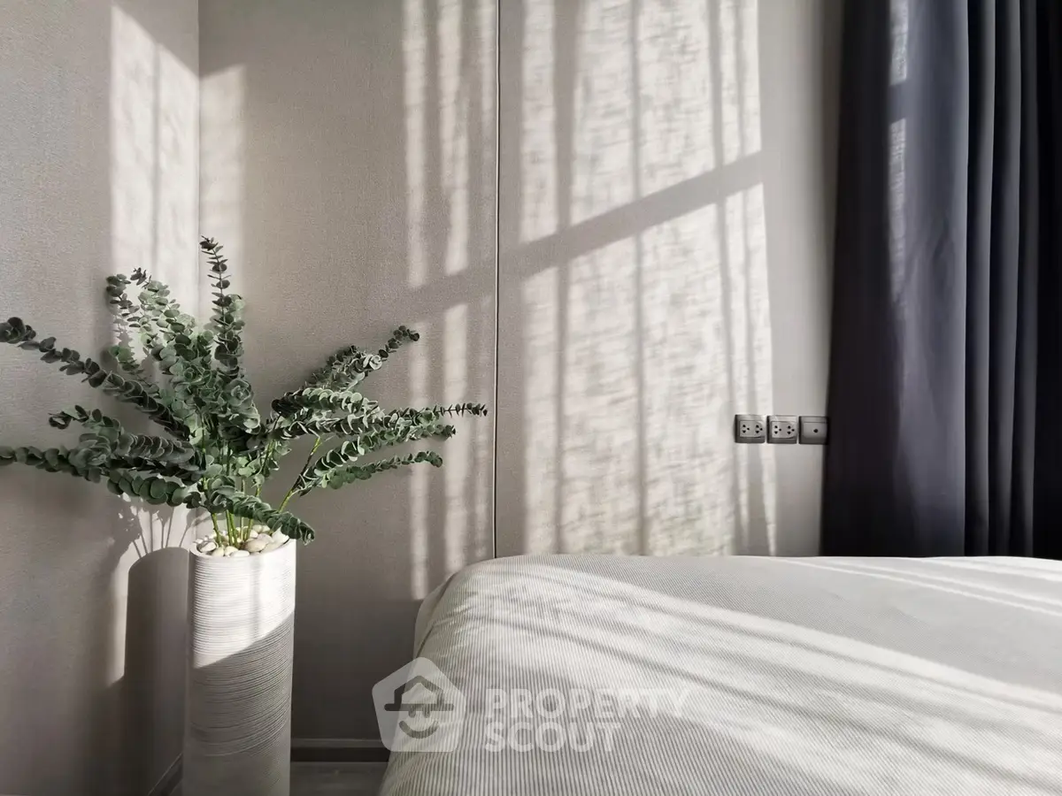 Serene bedroom with natural light and elegant decor