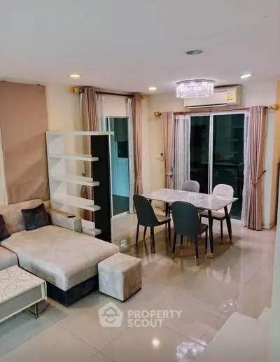 Modern living room with elegant dining area and stylish furniture