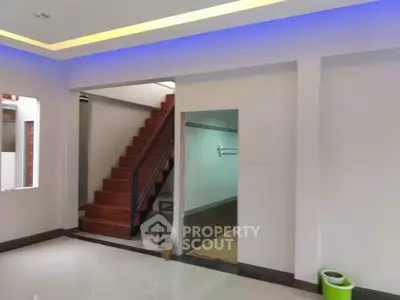 Modern interior with staircase and sleek lighting in a spacious home