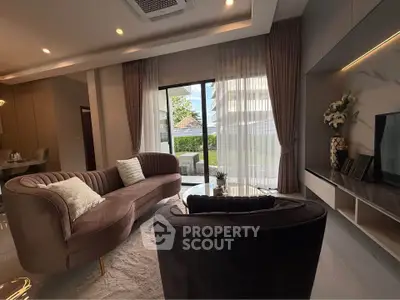 Luxurious living room with elegant furniture and garden view